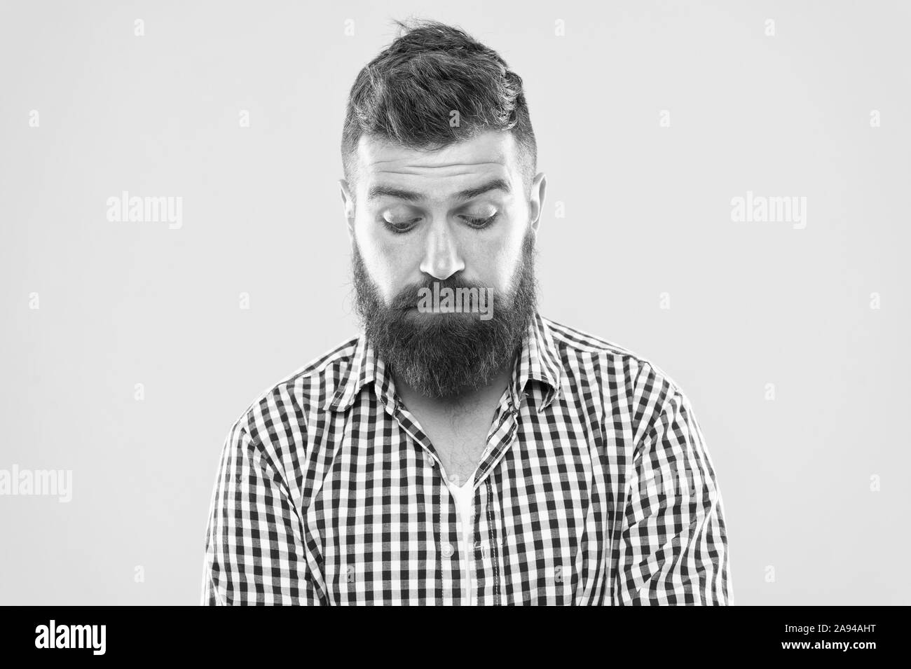 Feeling sorry. Embarrassment concept. Feel so sorry. Man bearded regretful face. Guy bearded sorry. Ask for apologies. Man with beard looks pitiful. Man regret about done and ask to forgive him. Stock Photo