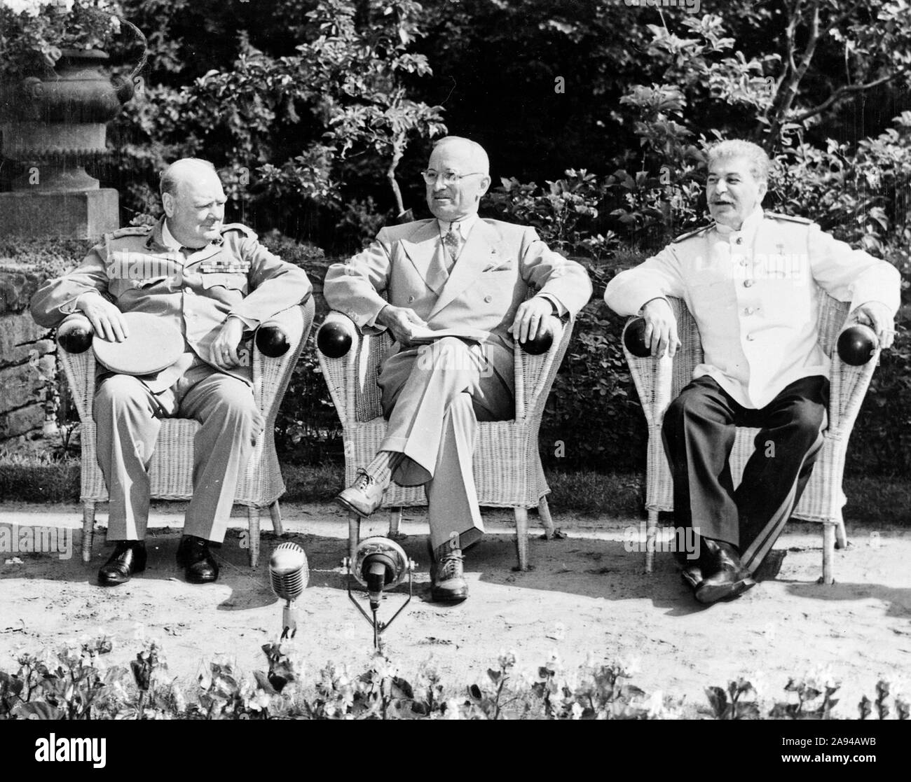 British Prime Minister Winston Churchill, President Harry S. Truman, and Soviet leader Josef Stalin in the garden of Cecilienhof Palace before meeting for the Potsdam Conference in Potsdam, Germany. July 25, 1945 Stock Photo