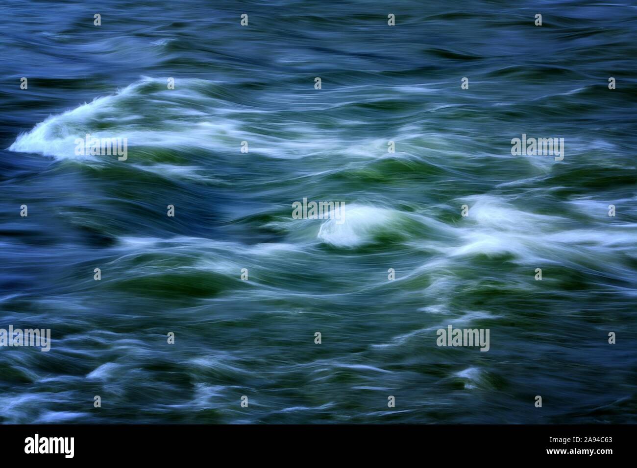 Beauty of blue and green flowing river water Stock Photo