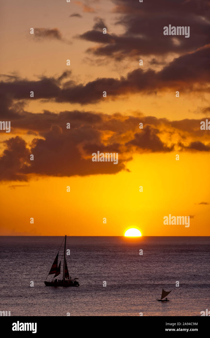 Sailing off Waikiki Beach at sunset; Honolulu, Oahu, Hawaii, United