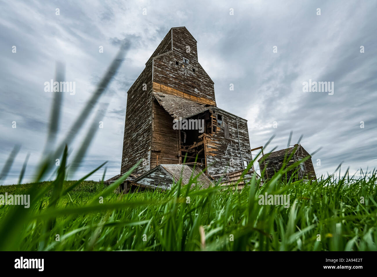 Weathered grain elevator on the prairies; Saskatchewan, Canada Stock Photo