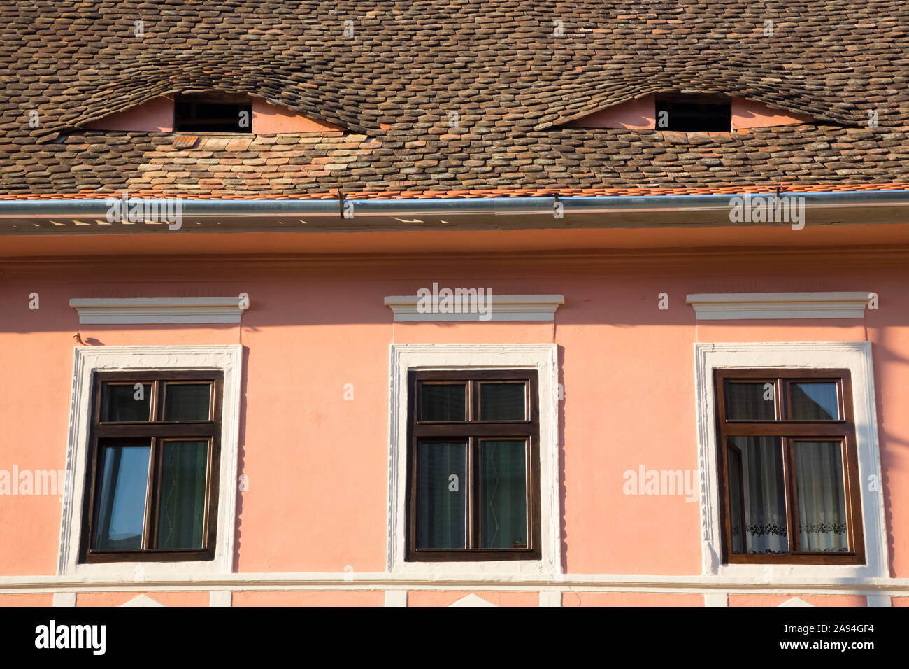 House with eyes; Sibiu, Transylvania Region, Romania Stock Photo