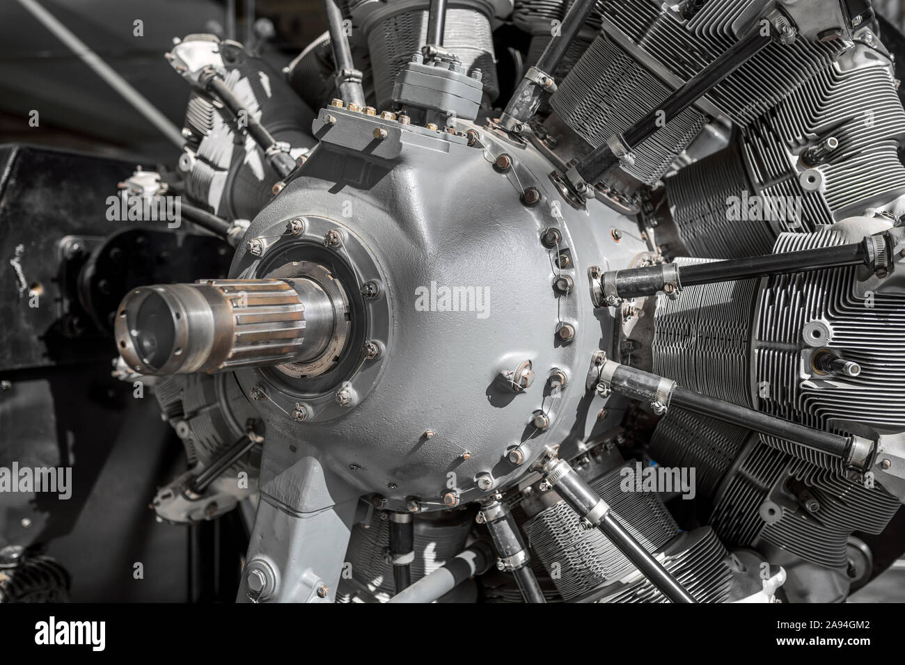 The front of the old classic aircraft engine with a powerful shaft for