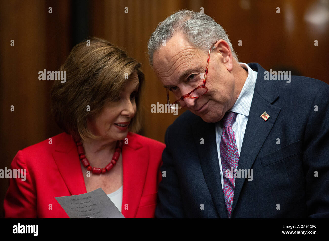Speaker of the United States House of Representatives Nancy Pelosi (Democrat of California) and United States Senate Minority Leader Chuck Schumer (Democrat of New York) speak to each other during a press conference on the Deferred Action for Childhood Arrivals program on Capitol Hill in Washington, DC, U.S. on Tuesday, November 12, 2019. The Supreme Court is currently hearing a case that will determine the legality and future of the DACA program. Credit: Stefani Reynolds/CNP /MediaPunch Stock Photo