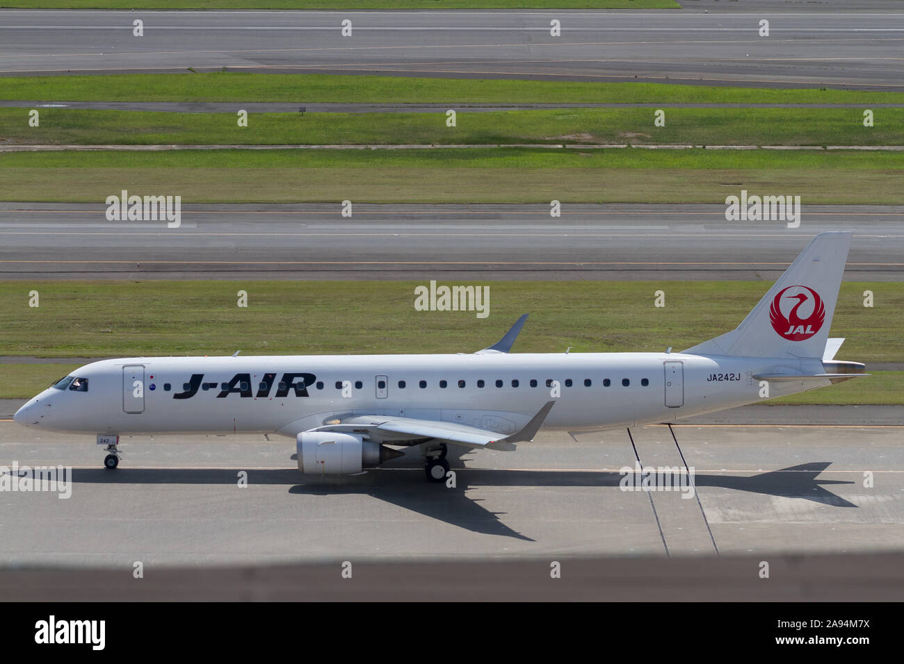 An Embraer 190-100STD operated by J-Air (part of the JAL group) at Haneda Airport, Tokyo, Japan. Stock Photo