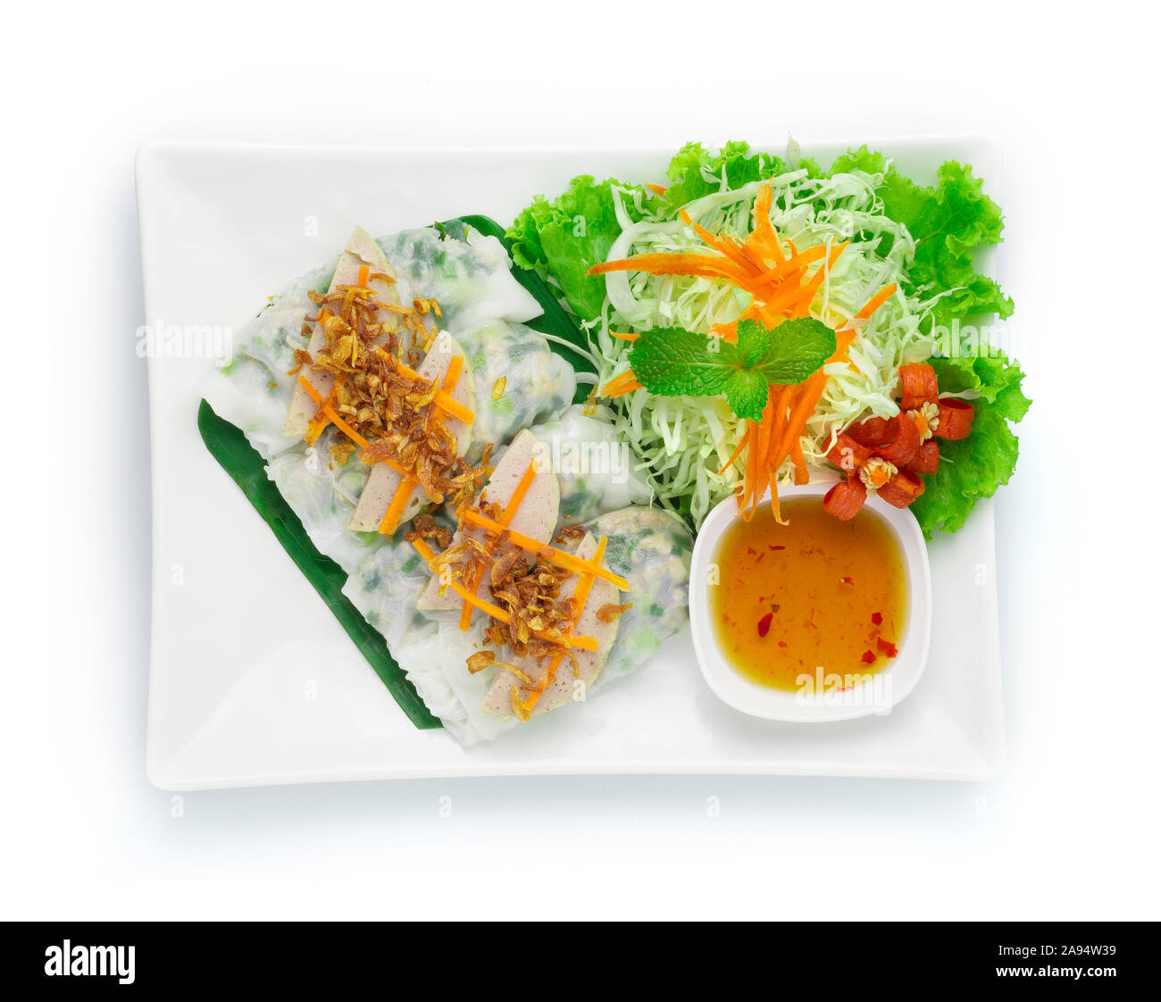 Rice flour Rolls Stuffed with ground pork and green onion ontop with Vietnamese Pork Saucesage