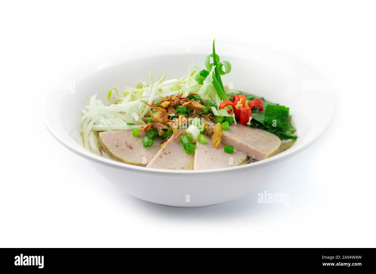 Rice Noodles with Vietnamese Pork Saucesage in Clear Soup (Pho) Vietnamese Food Style decorate with slice Cabbage,Vegetables and carved chili side vie Stock Photo