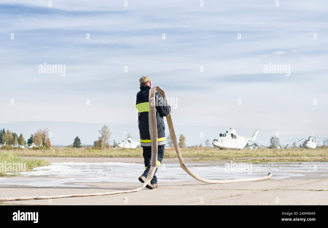 Rescue firefighters extinguish a large fire Stock Photo Alamy