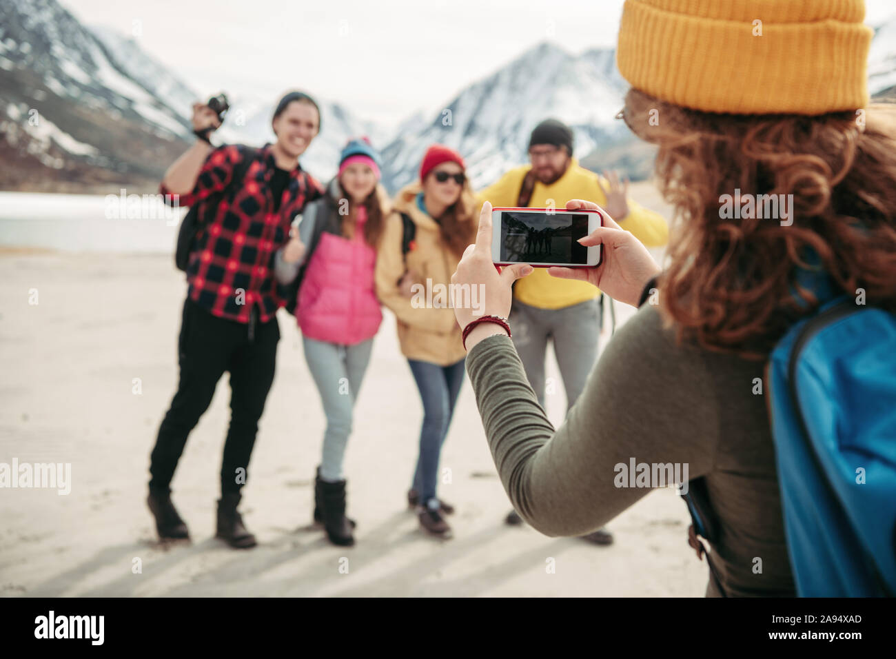 Group of happy friends hikers are taking photo together in mountains area Stock Photo