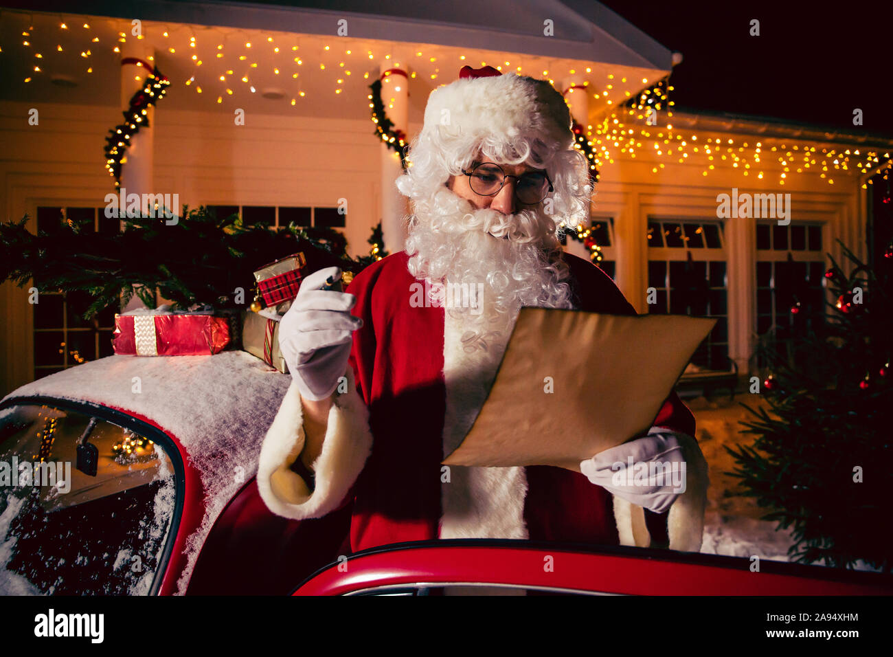 Damariscotta Christmas Events 2022 Happy Santa Claus Reading Christmas Letter Or Wish List Outdoors Near His  Red Car Stock Photo - Alamy