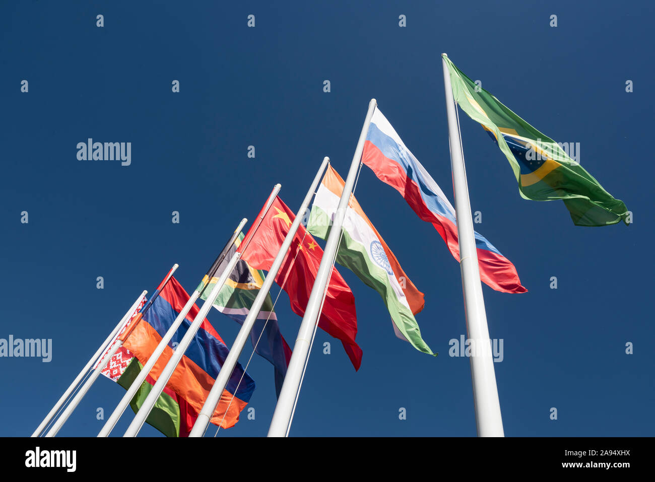 Flags of the BRICS countries in the blue sky. Stock Photo