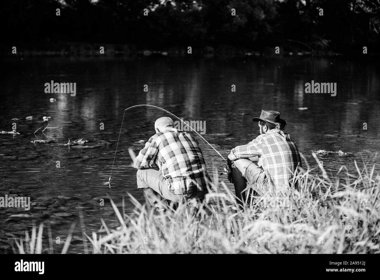 Man son fishing boat Black and White Stock Photos & Images - Alamy
