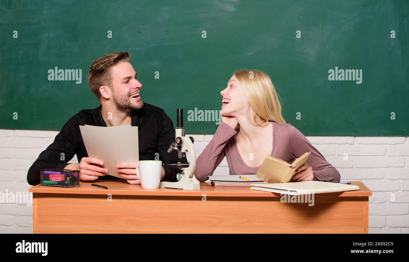 Home schooling. Couple of man and woman in classroom. Back to school ...