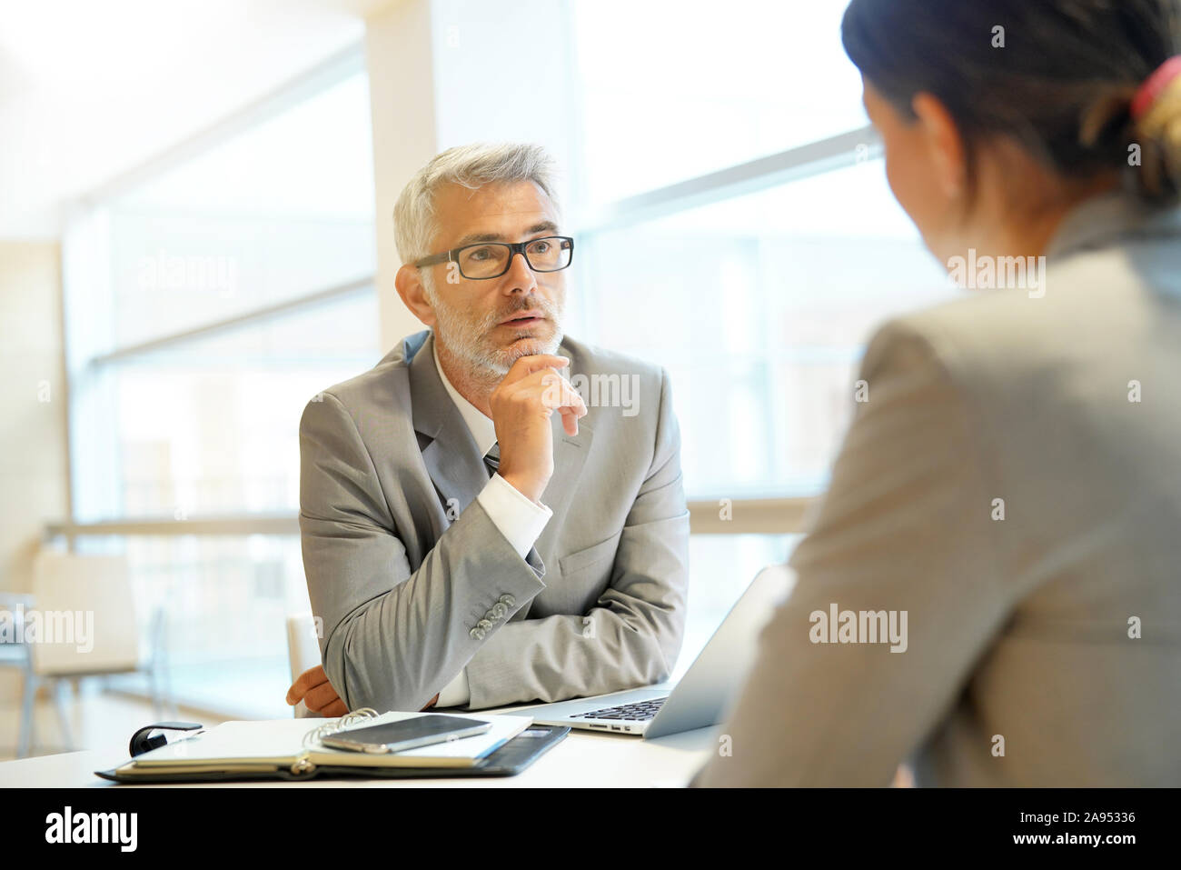 Coporate interview between executive and candidate Stock Photo