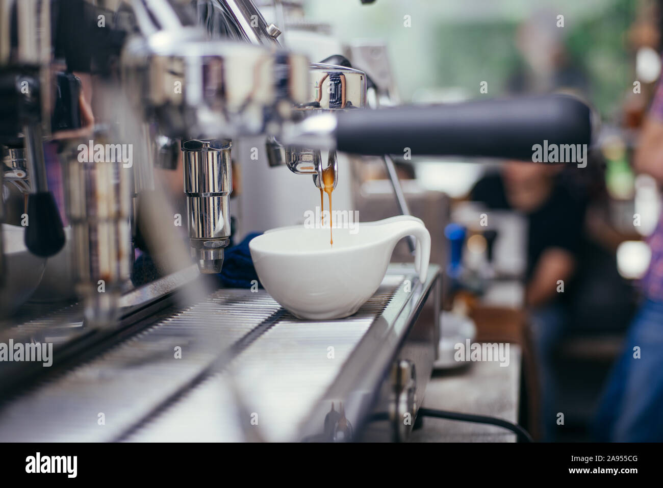 Professional coffee machine making espresso in a cafe bar Stock Photo