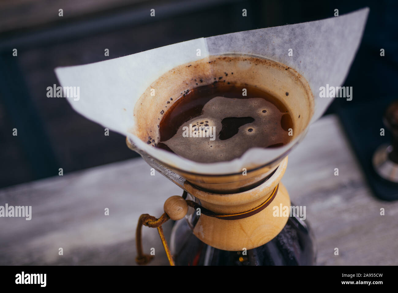 Making brewed black coffee from steaming filter drip style Stock Photo