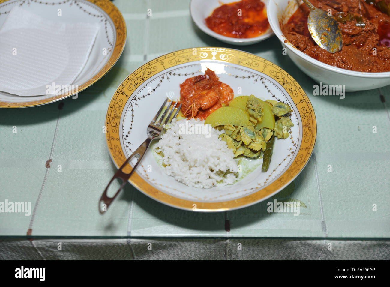 Steamed clams and shrimp curry, a traditional Indonesian dish Stock