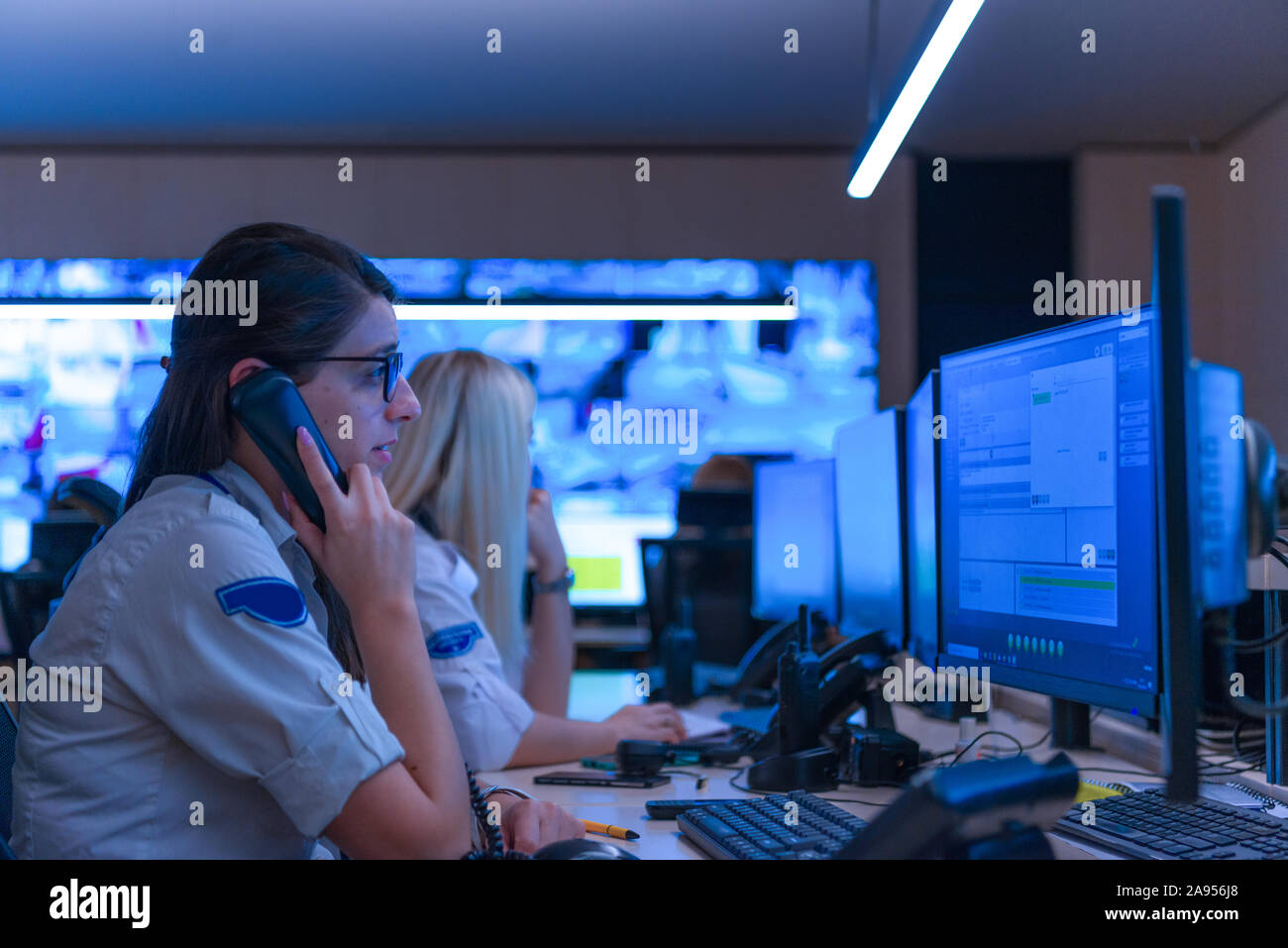 Technical Operator Works at His Workstation with Multiple Displays ...