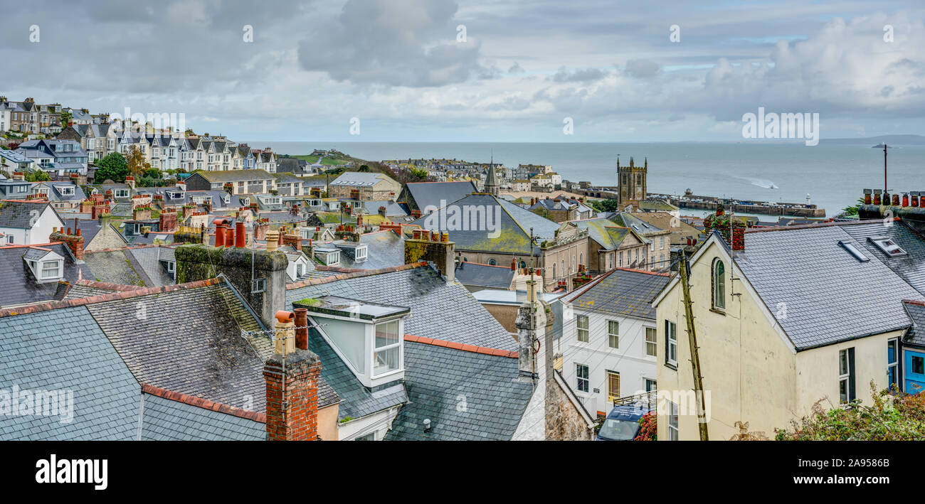 A panoramic taken from the top of St.Ives in Cornwall, England looking down over the town to the church and harbour at the edge of the Atlantic ocean. Stock Photo