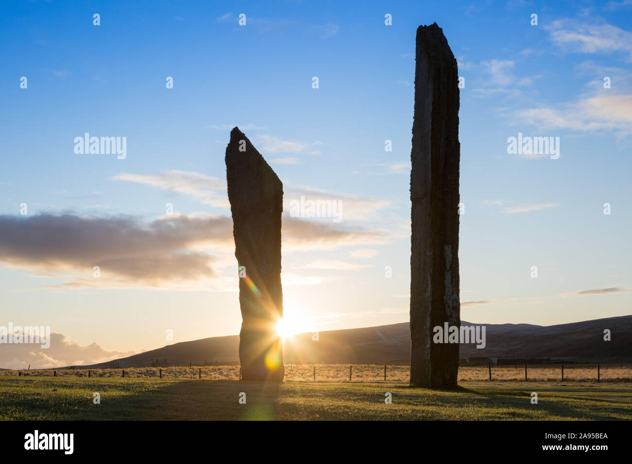 Stenness, Orkney, Scotland, UK. 13th November 2019. The sun rises behind the neolithic Standing Stones of Stenness, Orkney, Scotland, to a widespread frost. Stock Photo