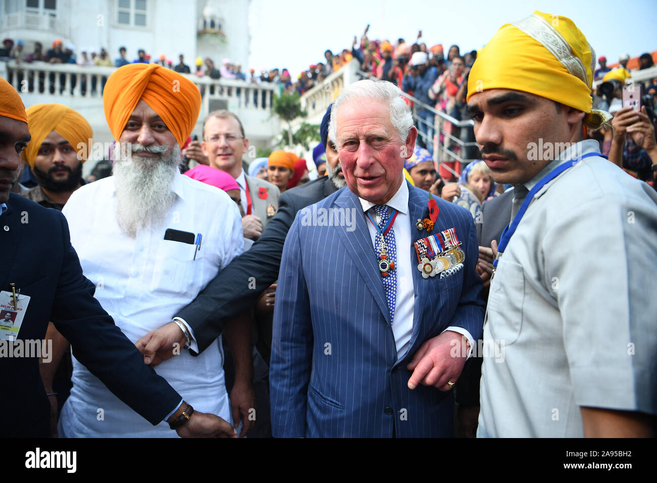 The Prince of Wales arrives at the Bangla Sahib Gurdwara Sikh Temple, New Delhi, to celebrate the 550th anniversary of the birth of Guru Nanak, the founder of Sikhism, on day one of the royal visit to India. Stock Photo