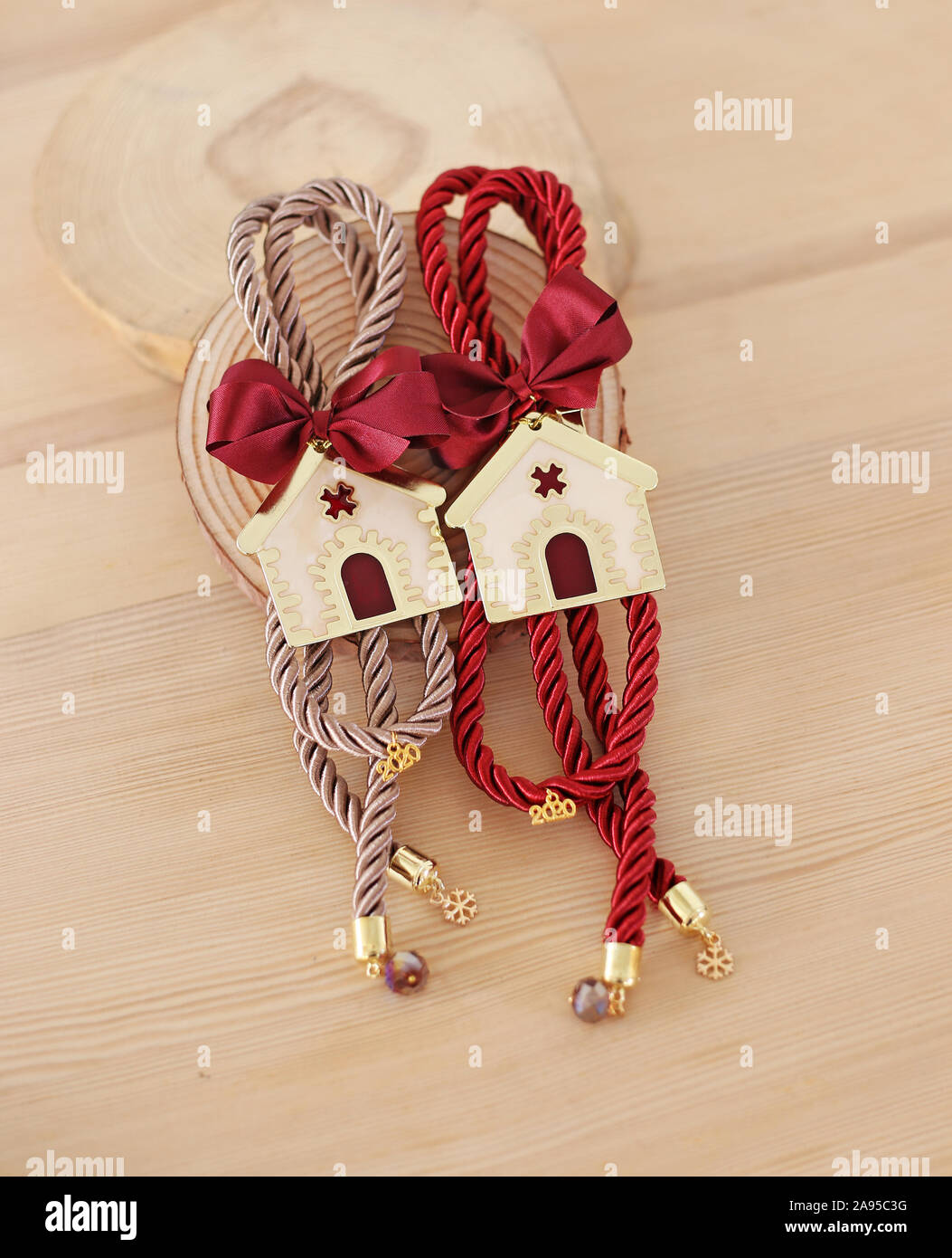 decorative Christmas lucky charms 2020 with metallic houses and ribbons Stock Photo