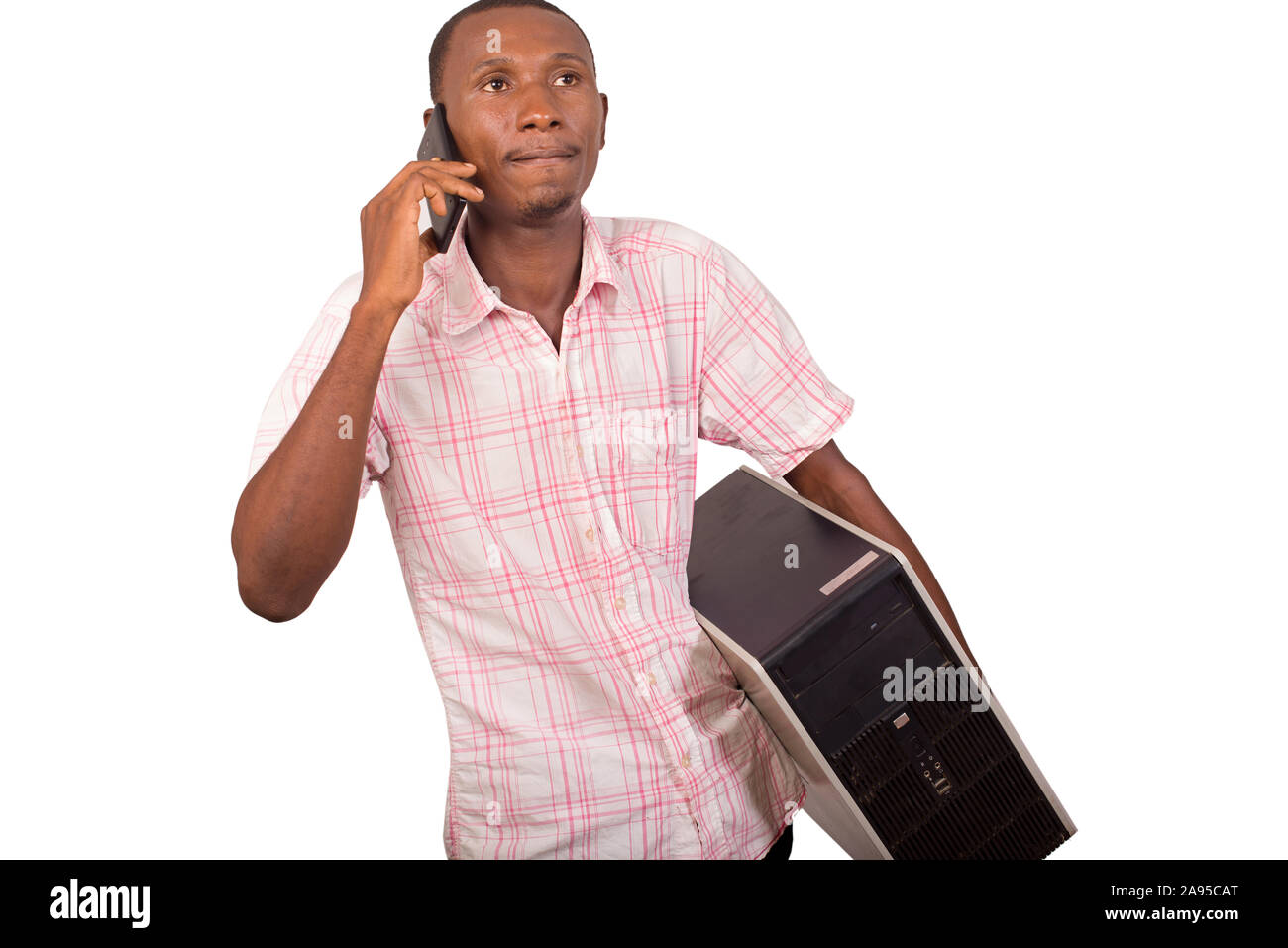 young technician with computer in hands and talking on the phone Stock Photo