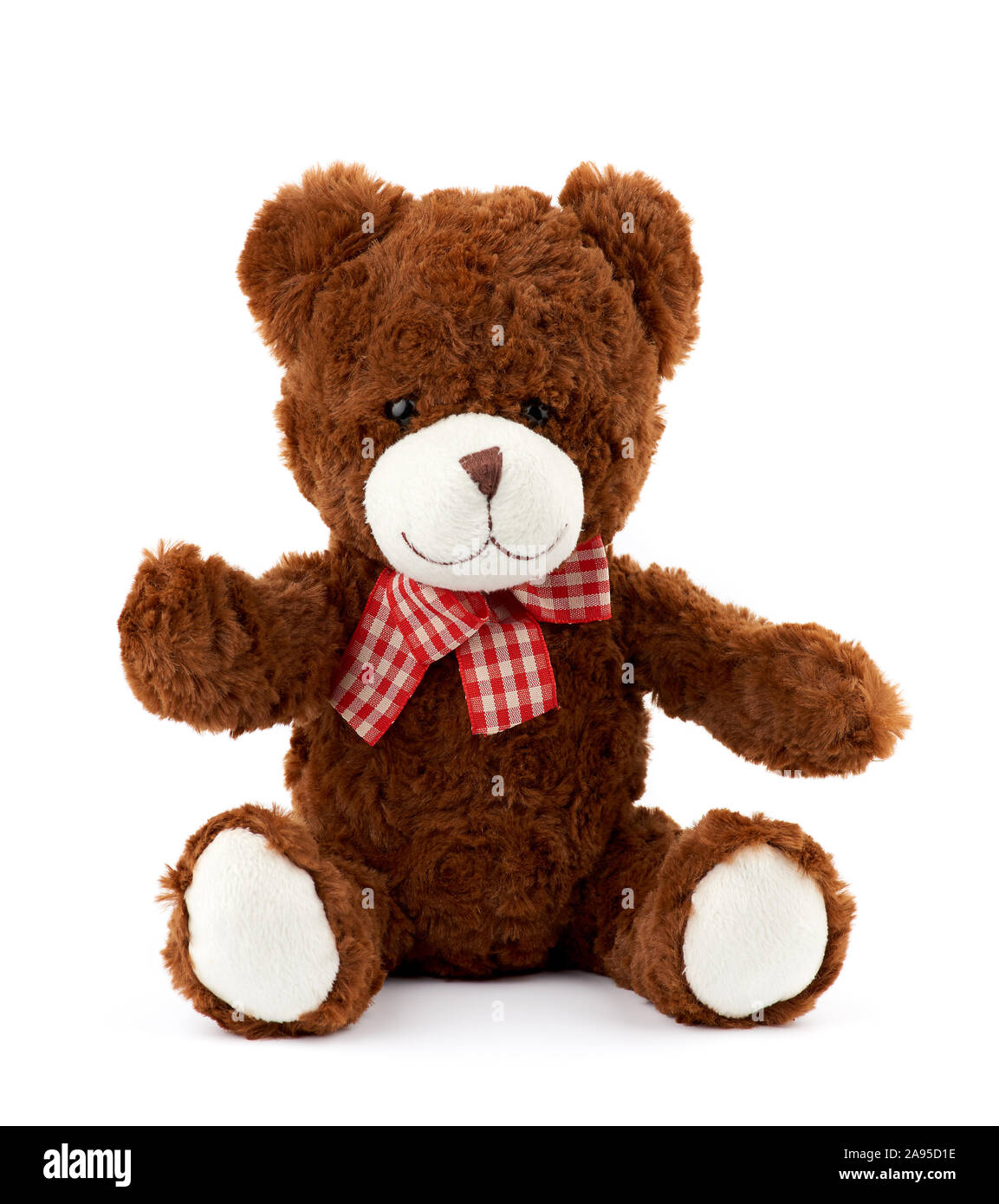 little cute brown teddy bear with a red bow on his neck isolated on a ...
