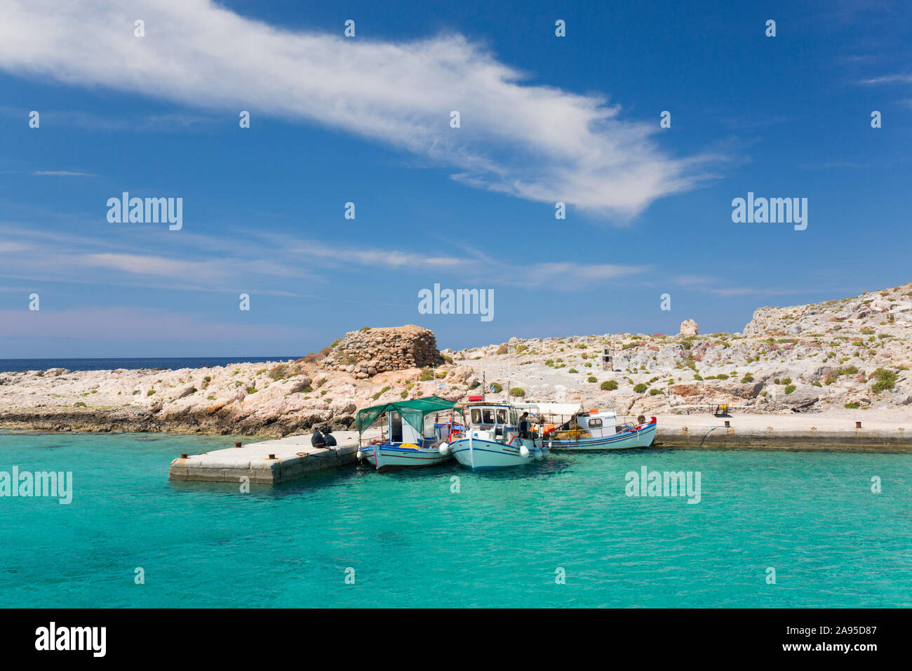 Imeri Gramvousa, Chania, Crete, Greece. Fishing boats moored alongside jetty in Gramvousa Bay. Stock Photo