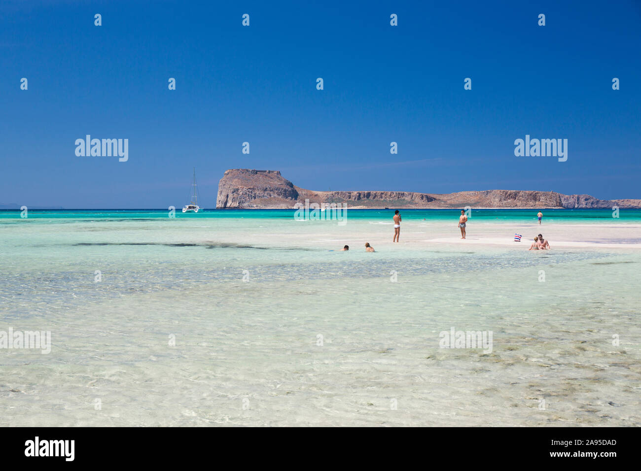 Balos, Chania, Crete, Greece. View from beach across the clear shallow waters of Gramvousa Bay to Imeri Gramvousa. Stock Photo