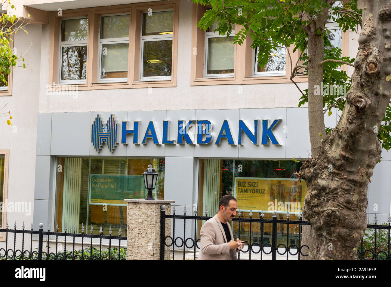 Istanbul, Turkey - November-10.2019: Halkbank is a state-owned bank. Photo of the exterior view of the minister located in Levent. Between the trees. Stock Photo
