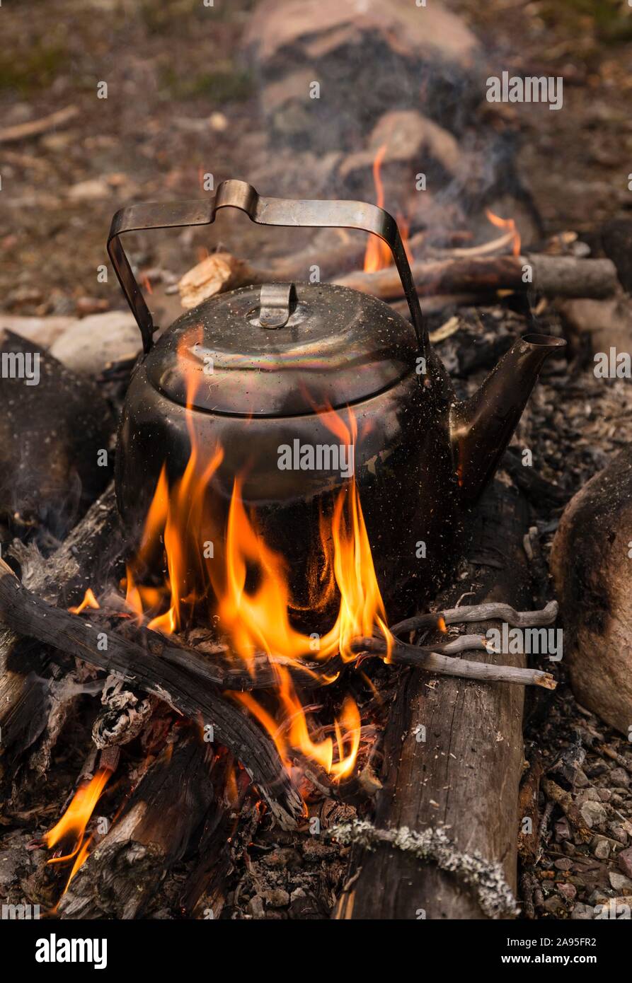 Premium AI Image  Vintage coffee pot on camping fire Wonderful