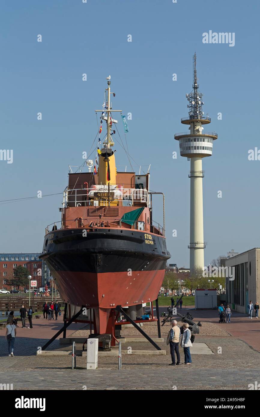 Tugboat Stier at the Museumshafen and Radio Tower, Bremerhaven, Bremen, Germany Stock Photo