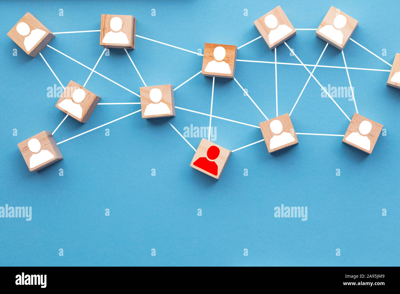 Wooden blocks connected together on a blue background. Teamwork concept