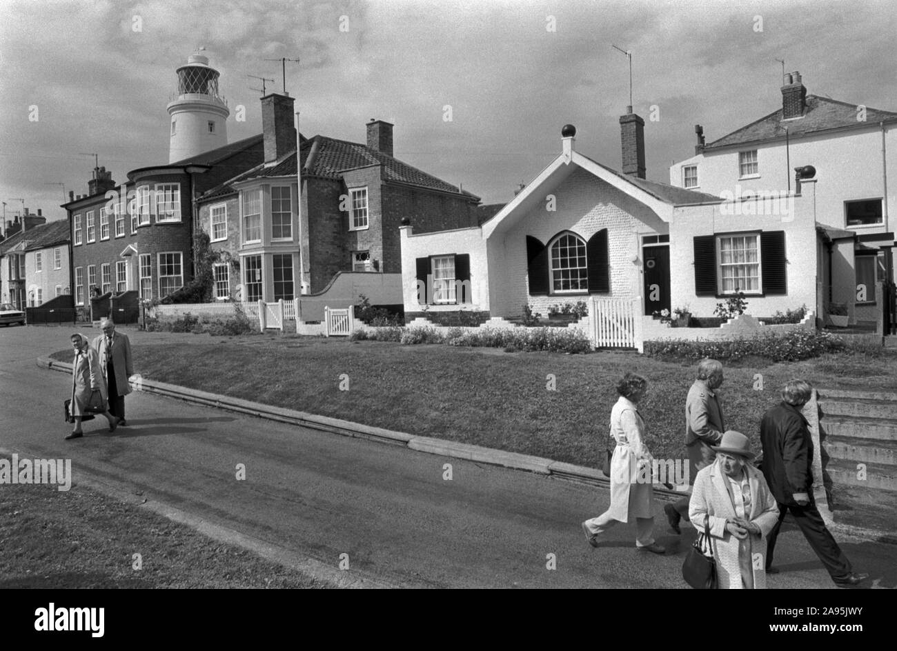 Seaside architecture Southwold Suffolk 1980s East Angelia UK. Older group people on a weekend summer break 1985 England HOMER SYKES Stock Photo