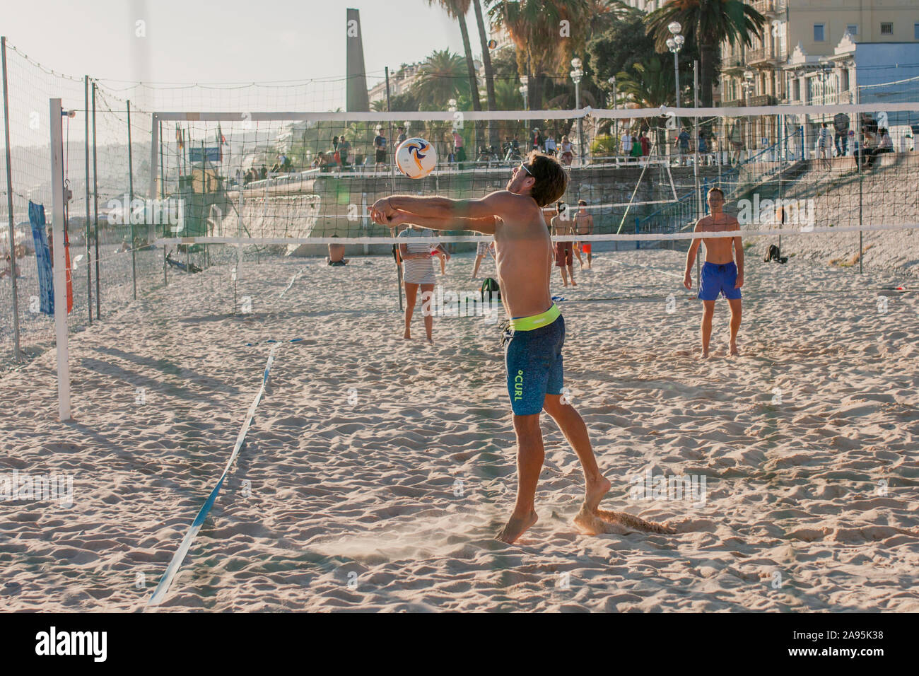 Nice, Provence / France - September 28, 2018: Young people on the beach playing beach volleyball Stock Photo