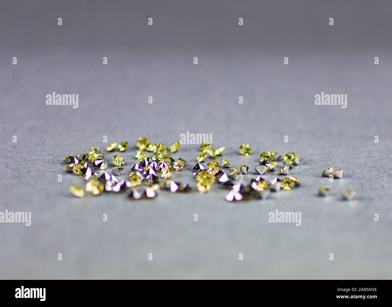 GolCrystal stones diamonds on grey neutral background. Copy space. Luxury celebration. Stock Photo