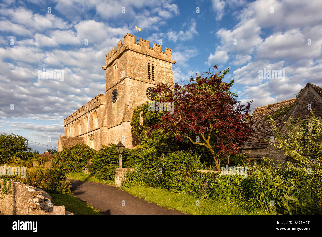 Exterior of All Saints Parish Church, Oaksey, Wiltshire on a bright summer evening Stock Photo