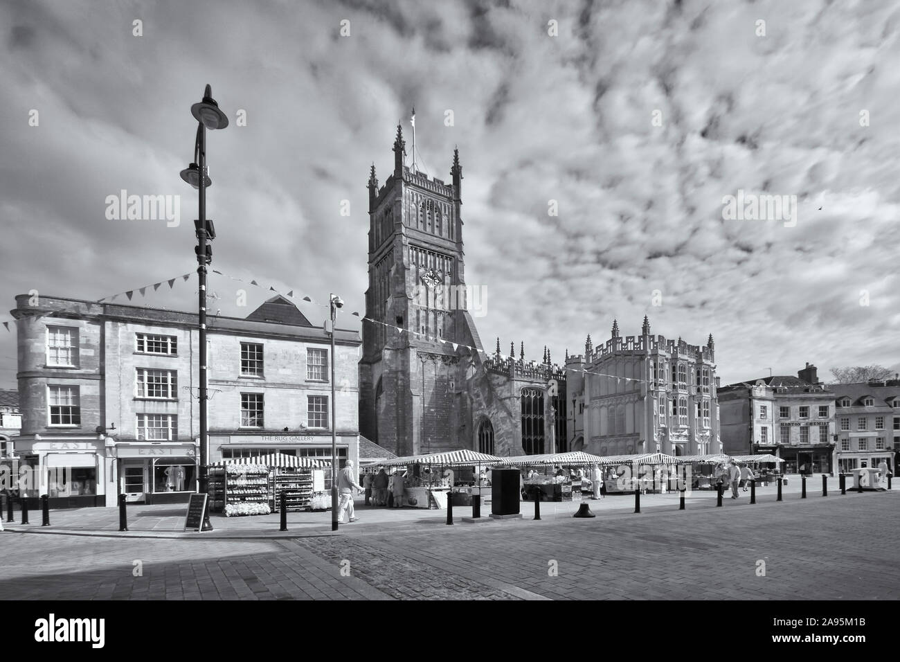 Black & white view of Cirencester town centre with the market place and parish church of St John the Baptist Stock Photo