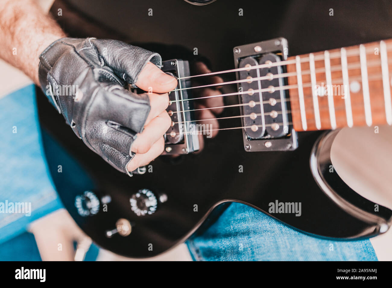 Closeup Of Rocker Hand In Leather Glove Playing Rock On Electric Guitar Stock Photo Alamy Closeup Of Rocker Hand In Leather Glove Playing Rock On Electric Guitar Stock Photo Alamy