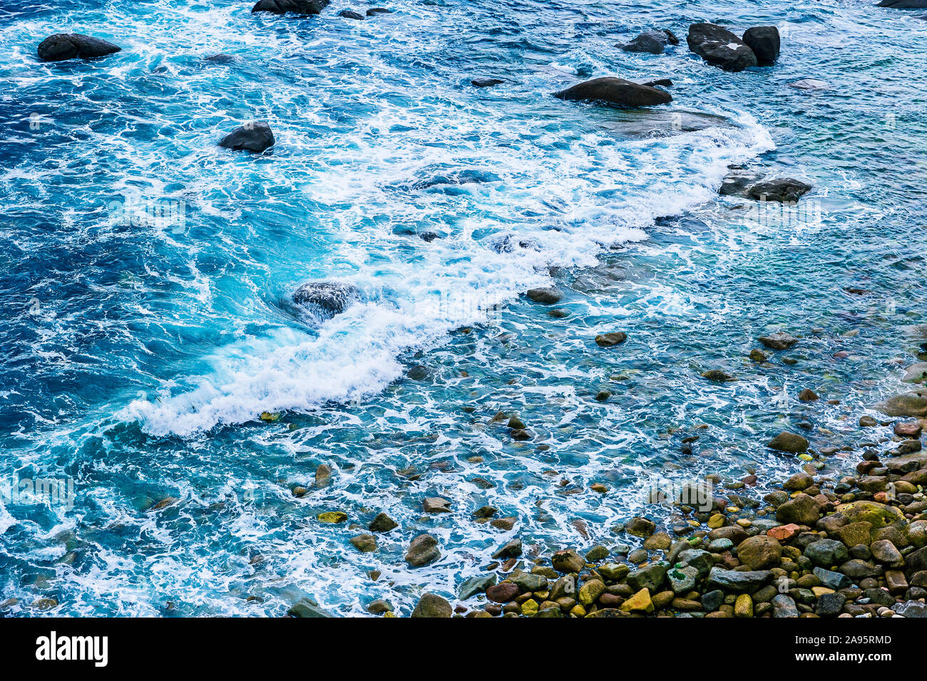 top view of waves splashing against the shore Stock Photo - Alamy