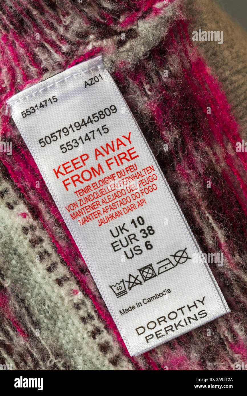 Label in Dorothy Perkins jumper made in Cambodia - keep away from fire in  different languages Stock Photo - Alamy