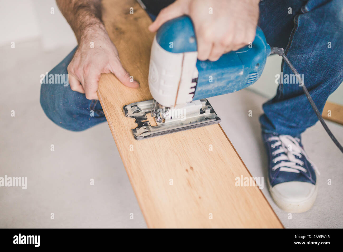 Do-it-yourself laminate installation at home - home craftsman Stock Photo