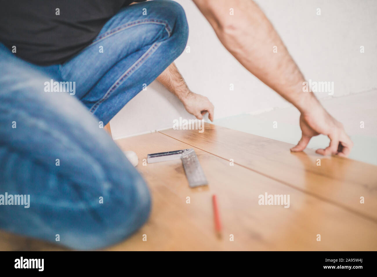 High-quality and professional work finisher - laying laminate Stock Photo
