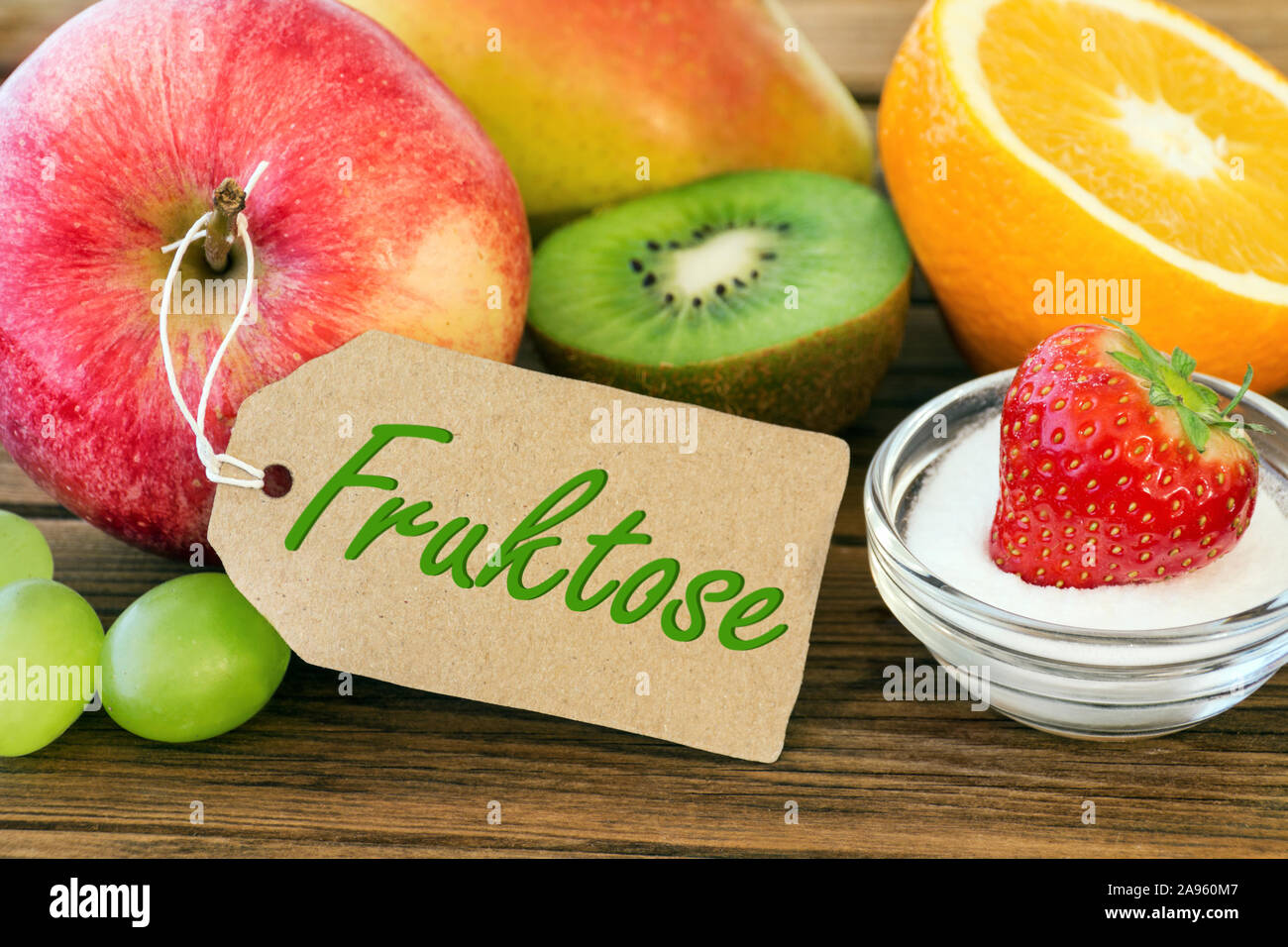 Fresh fruits with label German: Fructose Stock Photo