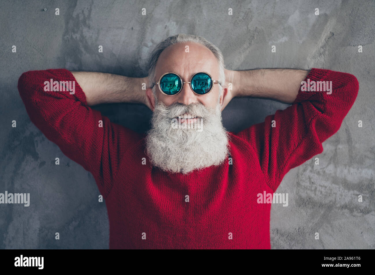 Top above high angle photo of positive festive old man relax day dream enjoy christmas time wear trendy jumper isolated over grey color background Stock Photo