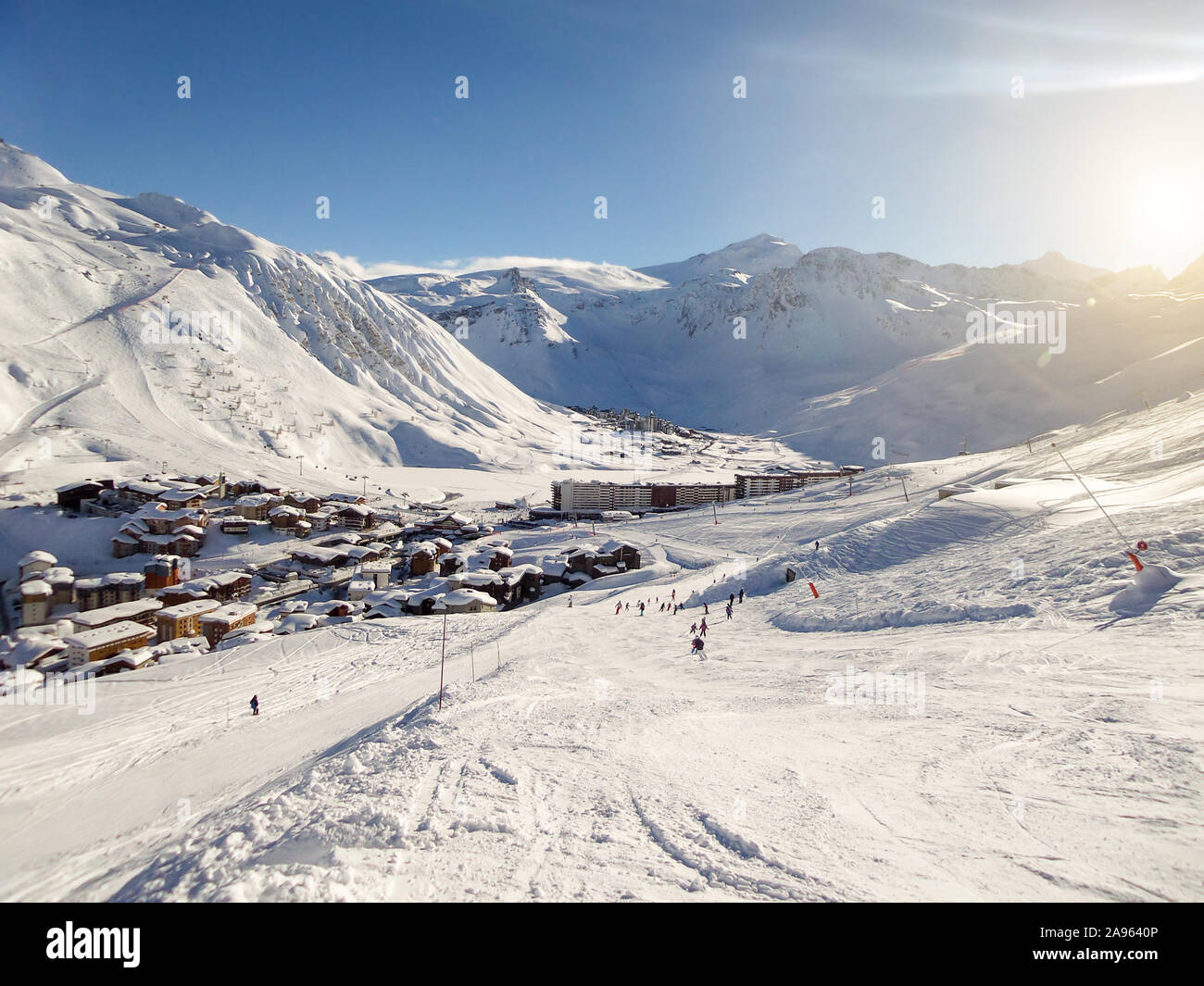 Ski resort of Tignes in winter, ski slope and village of Tignes le lac in the background Stock Photo