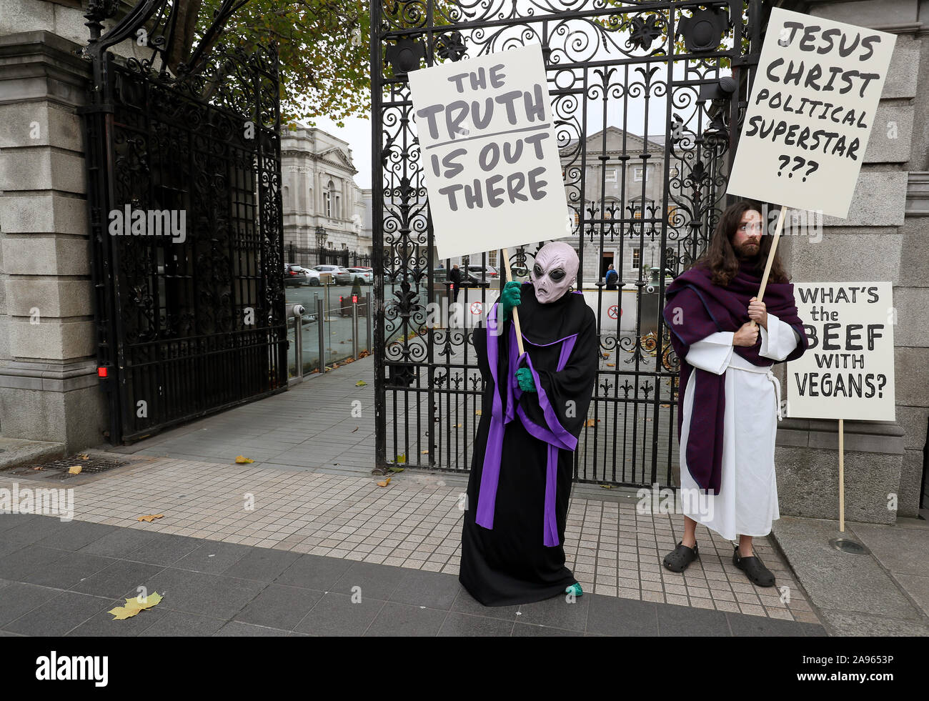 Actors dressed as an alien and Jesus Christ outside Leinster House in Dublin for the launch of the Festival of Politics 2019. Stock Photo