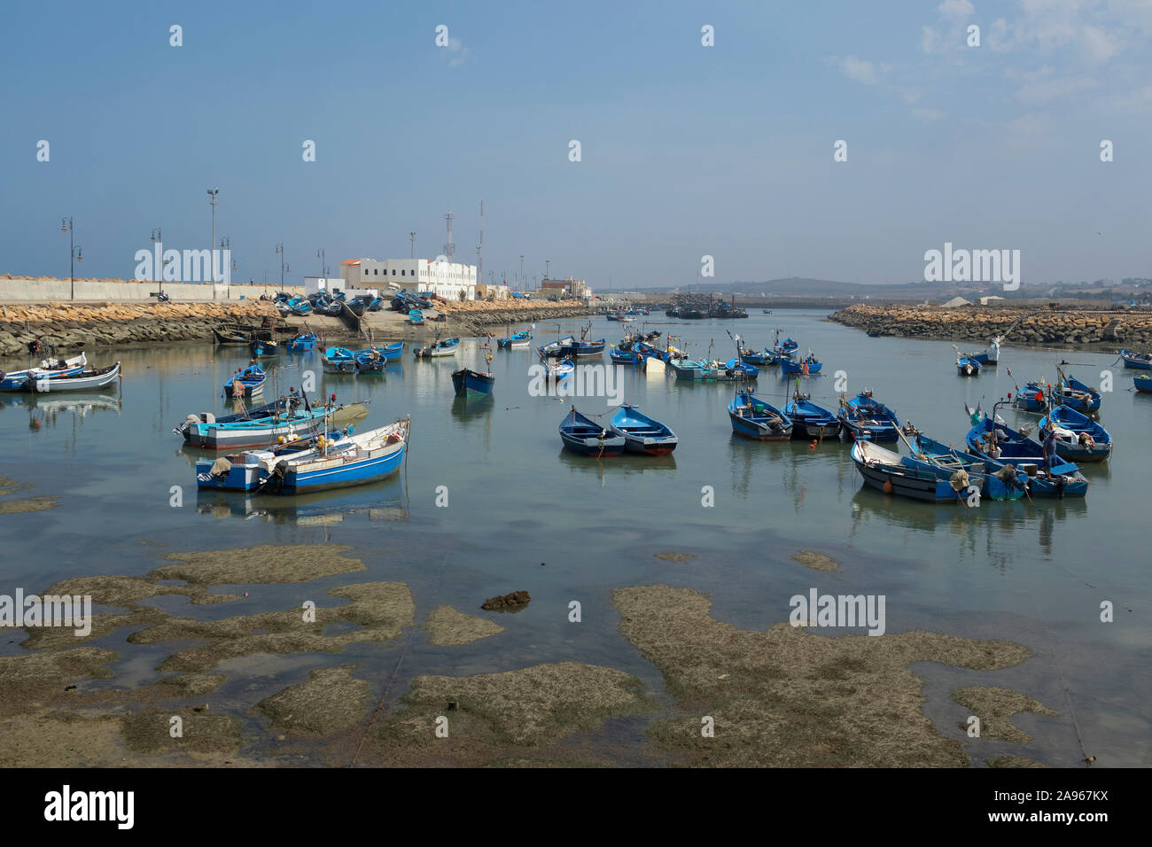 Asilah, Morocco-September 10, 2019: Traditional blue fishing boats in the harbour of Asilah, Morocco Stock Photo