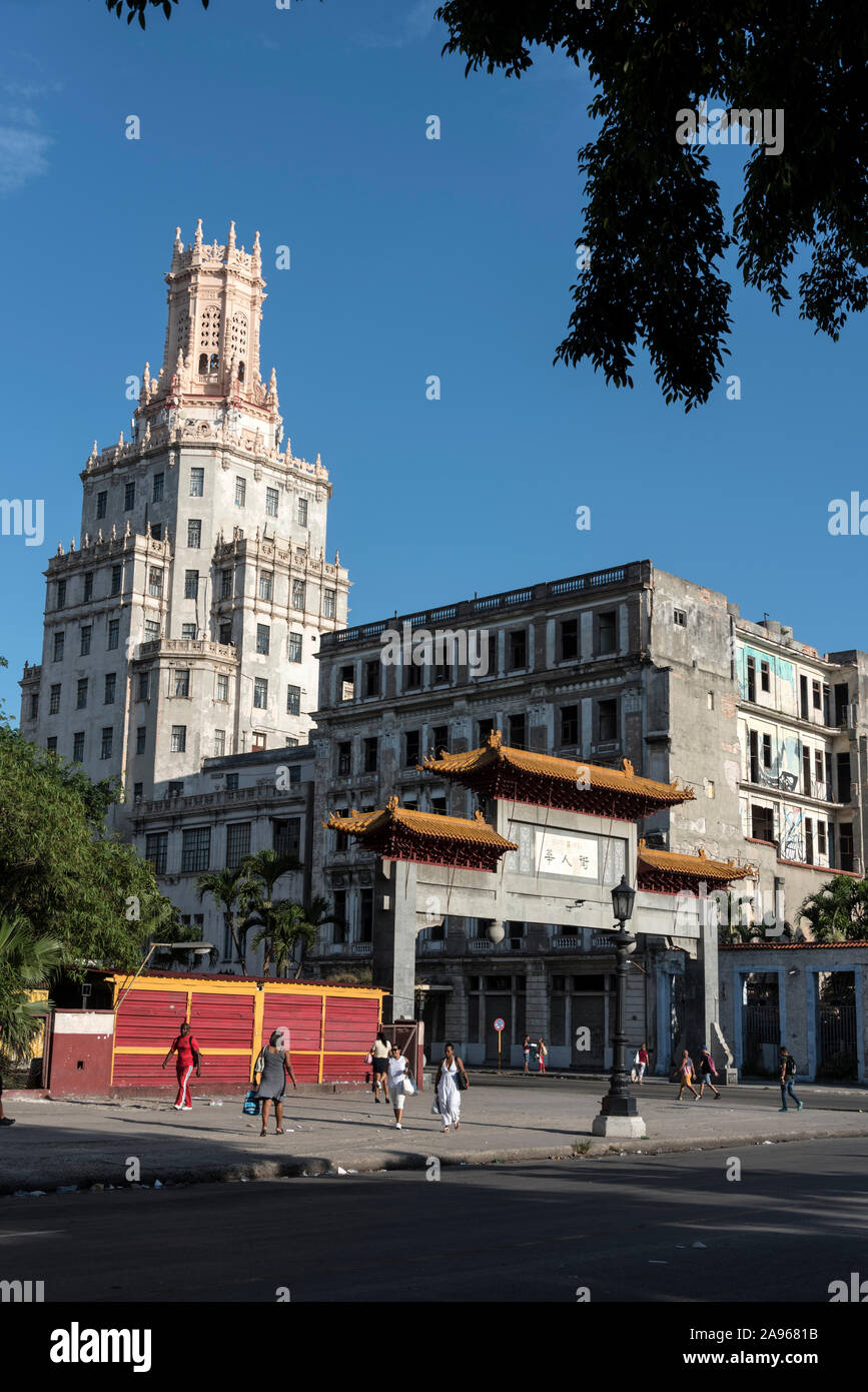The Chinese Quarter Gate or the paifang at the entrance of Havana's Chinatown -Barrio Chino in Cuba.   The tower is the ETECSA - Telecommunications Co Stock Photo